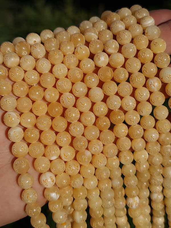 Perles calcite jaune gravée